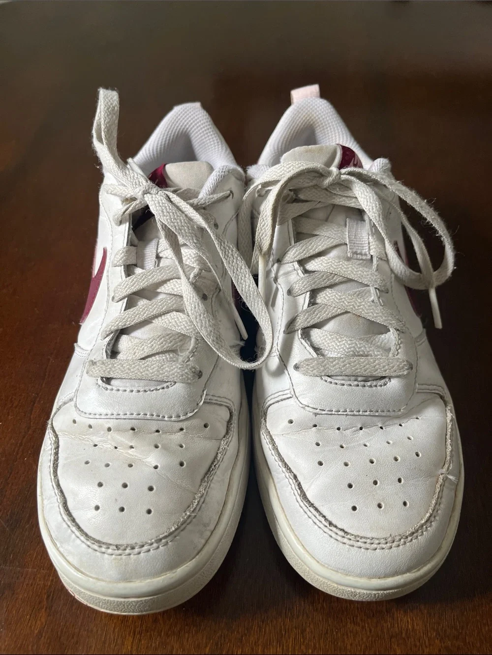 Nike Kids White Sneakers with Maroon Swoosh and Light Pink Details